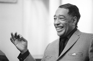 FILE - This April 24, 1969 file photo shows musician Duke Ellington in New York. "After Midnight," a joyous musical revue celebrating Duke Ellington's years at the famous Cotton Club nightclub in Harlem in the late `20s and early `30s, will begin shows downtown _ at the Brooks Atkinson Theatre on Broadway. Directed and choreographed by Warren Carlyle with musical direction by Wynton Marsalis, the show appeared off-Broadway last year at New York City Center under the name "Cotton Club Parade." (AP Photo/John Duricka, file)